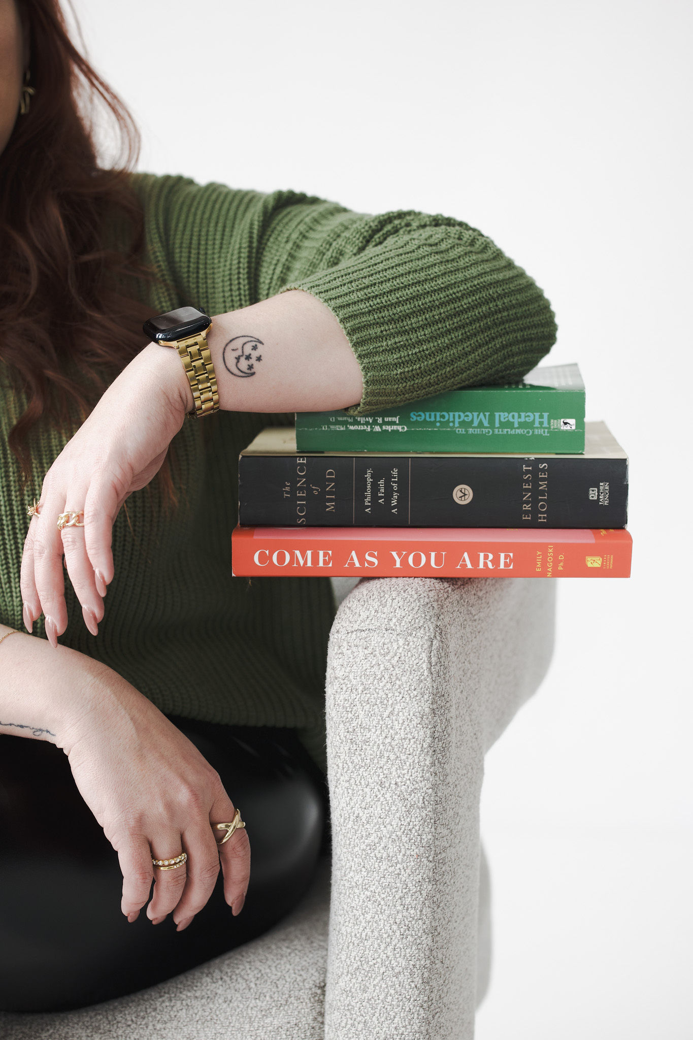 Elbow resting on books